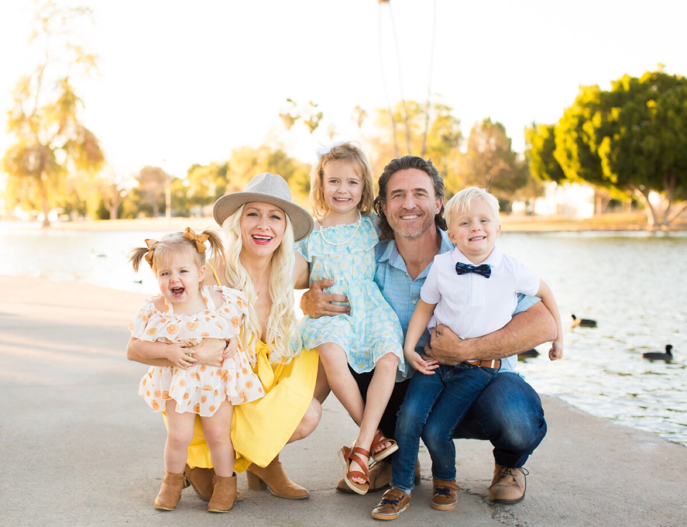 Family laughing together at sunset